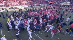 Michigan and Ohio State players brawl at midfield after the Wolverines' win in The Game.